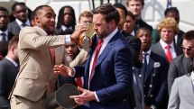 Vance drops college football championship trophy