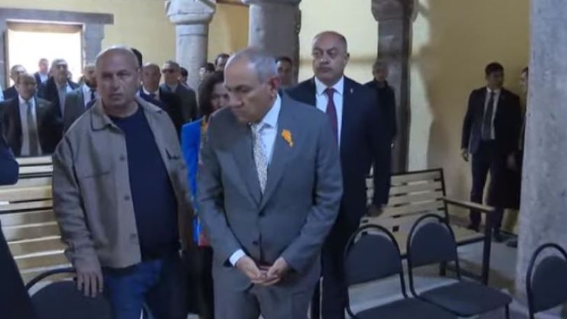 Armenian MP clashes with reporters during church ceremony