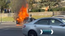 Car catches fire near Yerevan district administration building