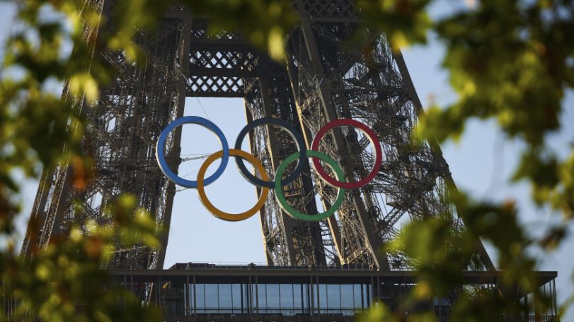 Paris Olympics rings mounted on Eiffel Tower