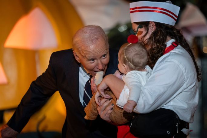 Biden bites baby dressed as chicken at Halloween event