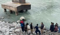 Bus carrying wedding guests falls into river in northern Pakistan