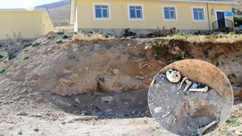 Skulls and bones exposed in mass grave near Van