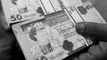 Libya withdraws notes bearing Gaddafi image
