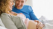 Men suffer pregnancy symptoms too: Fluctuating hormones make fathers-to-be less aggressive and more caring