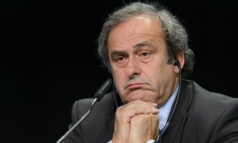 Platini pulls out of FIFA race, vows to clear name