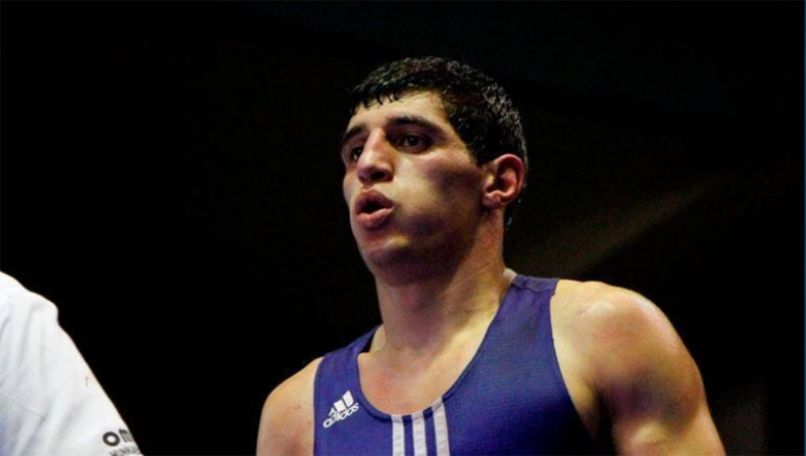 Boxer Vladimir Margaryan celebrates his first victory at the Olympics