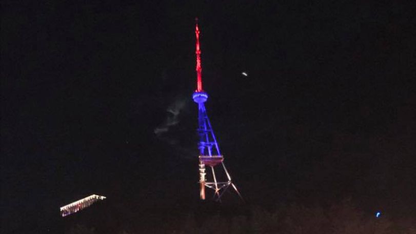 Tbilisi TV tower lit in national flag colors of Armenia