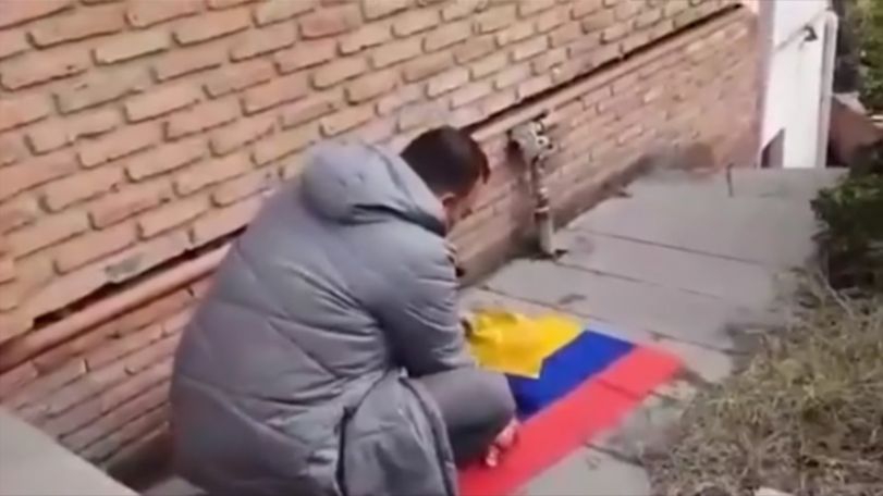 Social Media users outraged by an Azerbaijani man burning the Armenian flag in the church yard