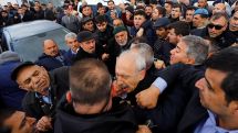 Protesters punch Turkish opposition leader at funeral