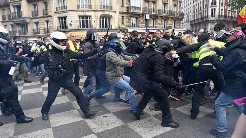 Agitators, tear gas cloud May Day march in Paris