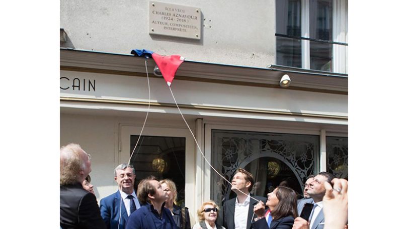 Charles Aznavour memorial plaque inaugurated at first Paris apartment building of Aznavour family