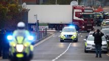 UK police investigating 39 lorry deaths raid two addresses