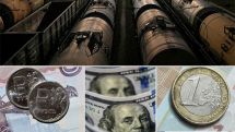 Рубль снижается к доллару и евро на фоне дешевеющей нефти