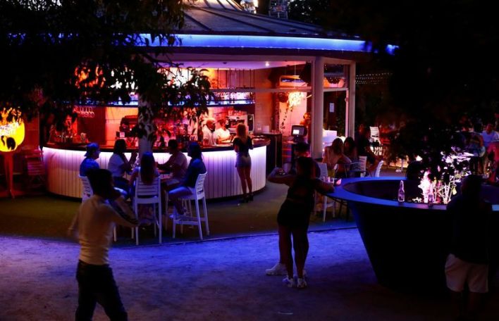 Spain bans public drinking, closes clubs due to coronavirus surge