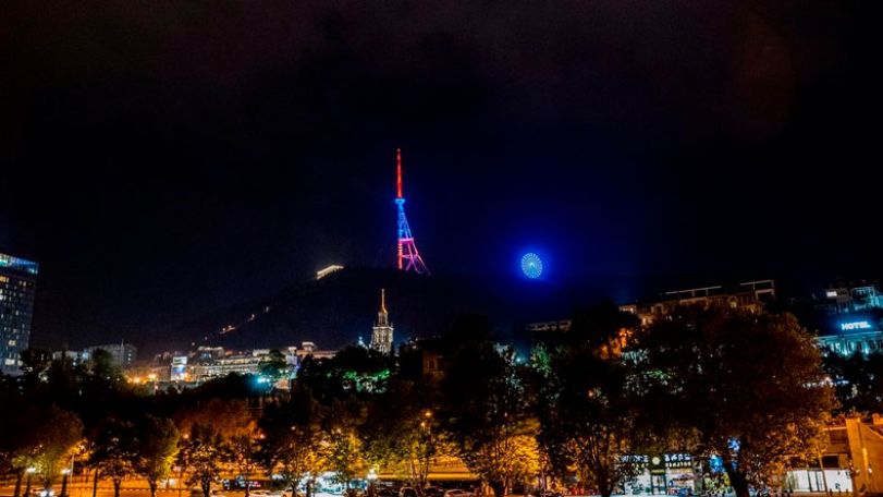 Tbilisi TV tower lit in national flag colors of Armenia