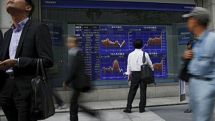 Asian shares, dollar edge down as markets eye Greece