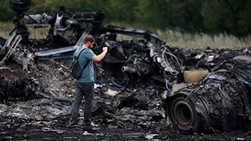 Why was MH17 flying through a war zone where 10 aircraft have been shot down?