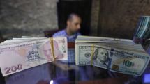 Turkish lira strengthens past 7 per dollar to six-month high