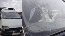 Azeris throw stones on a vehicle transporting bodies of killed servicemen of the Artsakh war