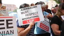 The parents of war prisoners and missing soldiers protest outside the government building
