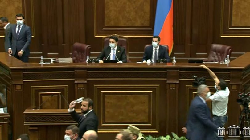 Armenian lawmakers throw water bottles as a new brawl breaks out in parliament