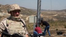 Russian peacekeepers provide security during construction of dirt road to cell tower in Artsakh