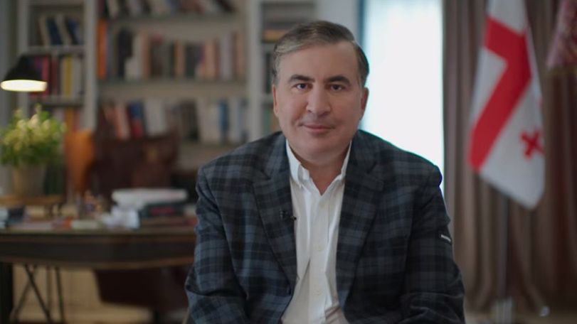 Georgian ex-president says he will fly home despite jail threat