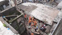 Eight-storey residential building collapses in India following heavy rains
