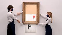 Banksy sets auction record with £18.5m sale of shredded painting