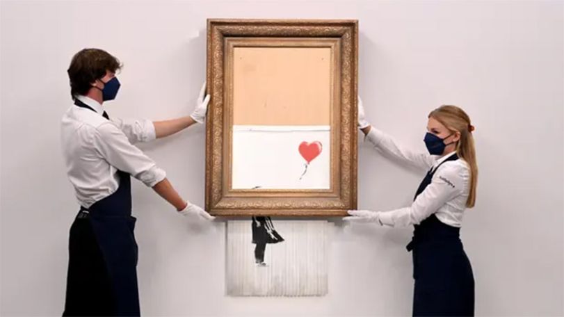 Banksy sets auction record with £18.5m sale of shredded painting