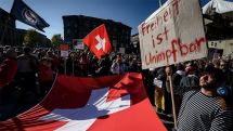 Swiss vote on ending restrictions while Covid cases surge