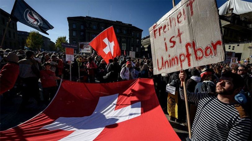 Swiss vote on ending restrictions while Covid cases surge
