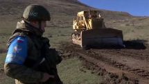 Russian peacekeepers ensure security while mining rubble for construction of new road in Artsakh village