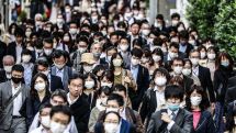 Japan says it will remove more COVID restrictions