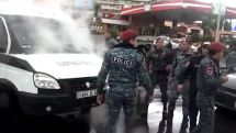 Police van catches fire during opposition protests in Yerevan