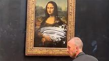 Man smears Mona Lisa with cake at Louvre
