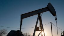 Oil prices fall in volatile trade