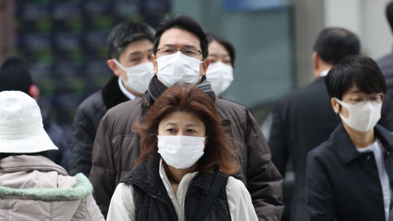 Japan eases mask guidelines, but few people are keen to change