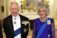Britain's Charles to wear crimson and purple robes at coronation