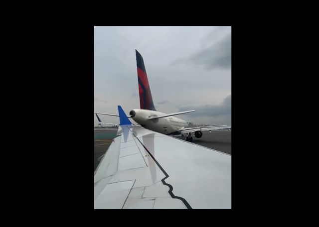 United Airlines plane clips tail of parked Delta jet at Boston airport